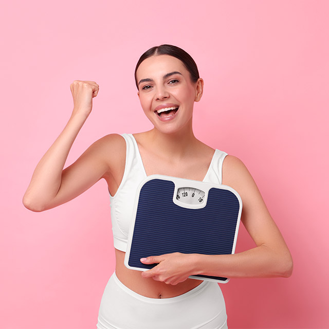 Excited Weight loss_ Excited Woman Achieving Weight Loss Success